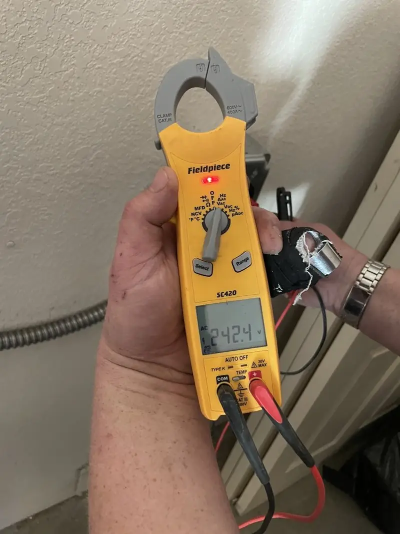 Voltage testing with clamp meter during Electrical Installation Services in Hiawatha